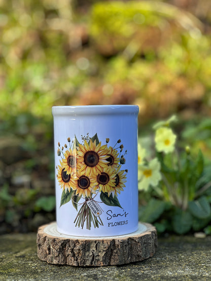 Ceramic vase with sunflower design on a natural background