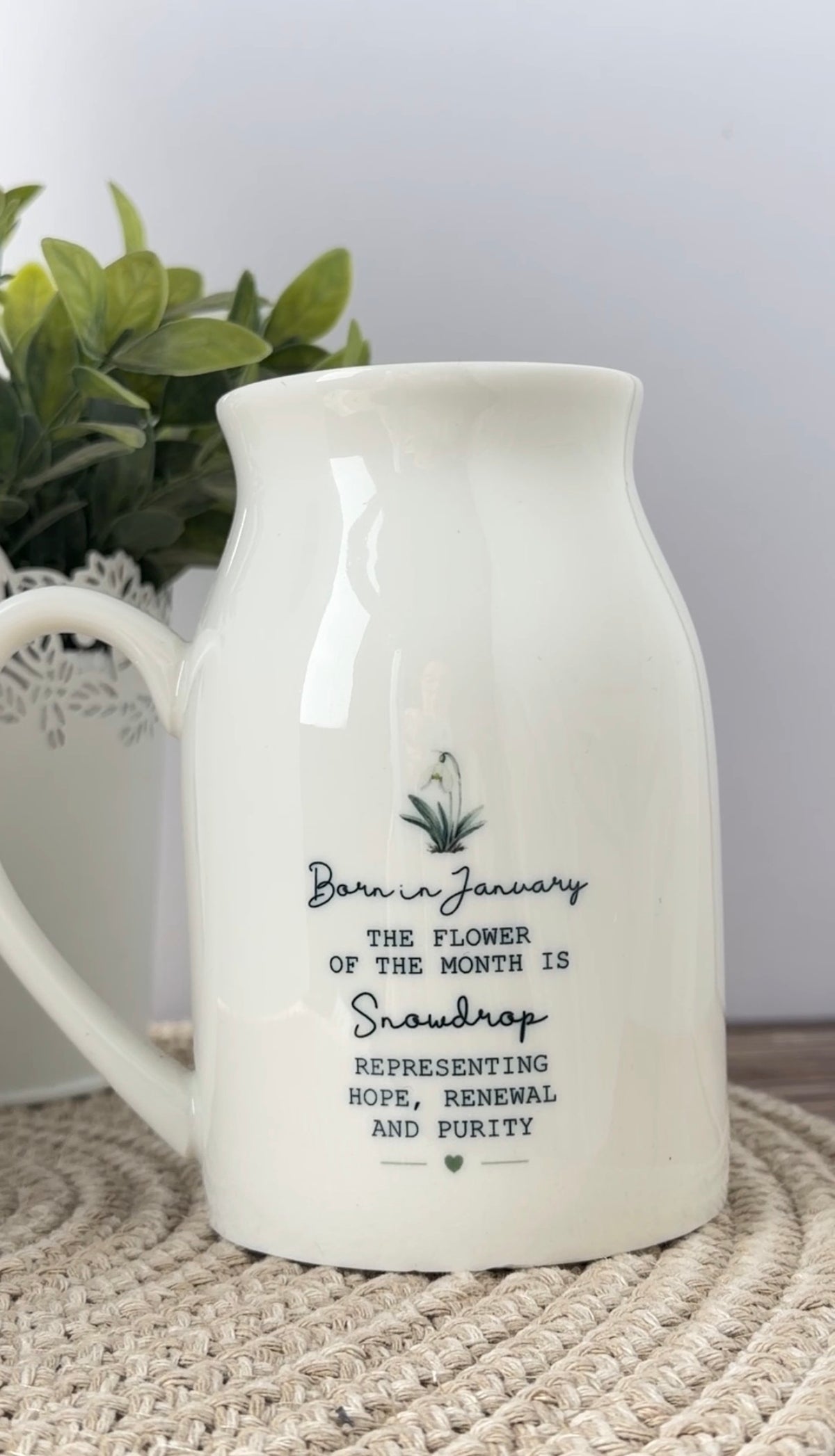 Back of the personalised January snowdrop birth flower jug showing the matching flower wording and its special meaning.