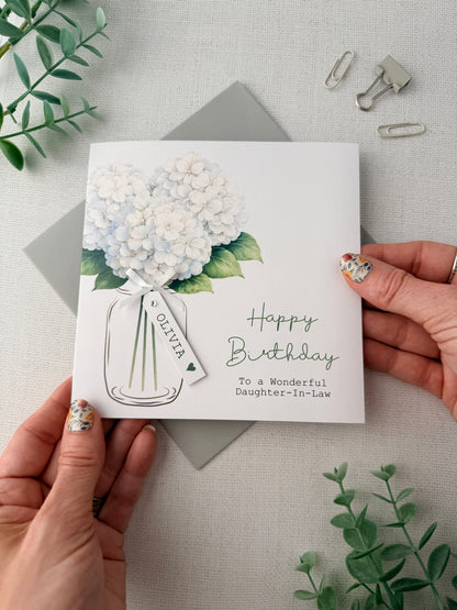 A handmade card featuring Hydrangea flowers in white, personalised with the wording of your choice.