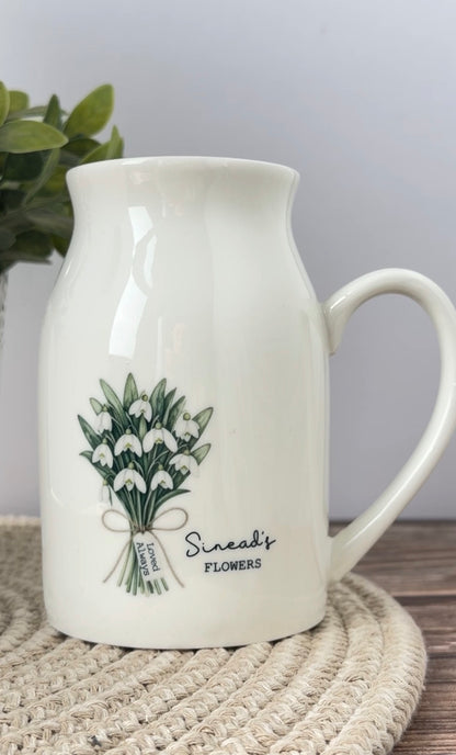 Personalised January birth flower jug featuring a watercolour snowdrop design, custom name and personalised mini message tag.