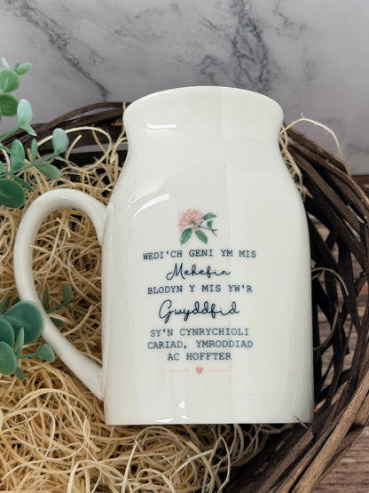 Back of the personalised June honeysuckle birth flower jug showing the Welsh birth flower wording and its special meaning.
