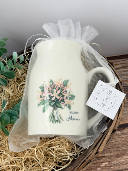 Personalised birth flower jug in its organza gift bag, showing the thoughtful presentation of this floral keepsake.