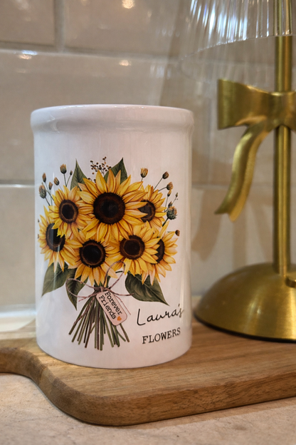 White ceramic base with sunflower design and personalised with the recipients name and a phrase or date of your choice.