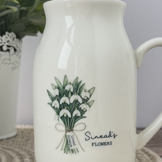Personalised birth flower jug video showing the January snowdrop design and June honeysuckle design, with personalised names, mini message tags and matching birth flower meanings in English and Welsh.